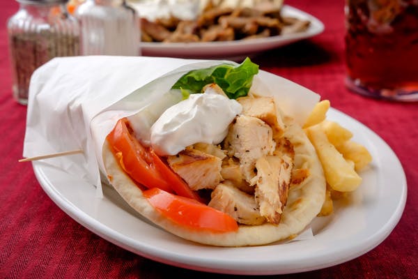Chicken Gyros
Seasoned grilled chicken, lettuce, tomatoes, and onions wrapped in a warm pita.
_