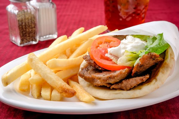 Original Gyros
Beef and lamb marinated in a perfect blend of Greek spices, placed on rotisserie until a delicate brown, and wrapped in warm pita. Topped with tzatziki sauce, lettuce, tomatoes, and onions.
_